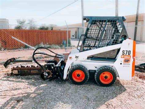 cat trencher hydraulics on a bob bobcat skid steer|bobcat mounted trencher for rent.